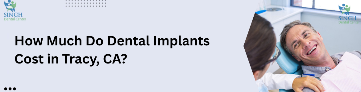 A dentist showing a dental implant on a model of teeth 
